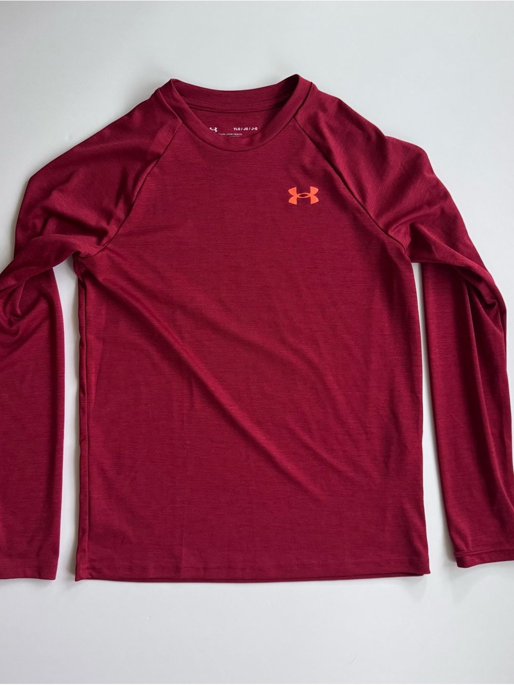 Under Armour Youth Maroon Long Sleeve Crew Performance Shirt with Orange Logo